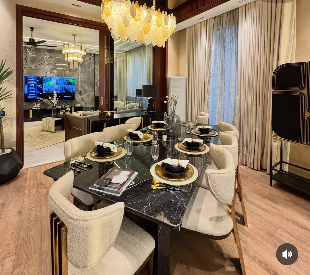 A dining room with a long wooden table and chairs